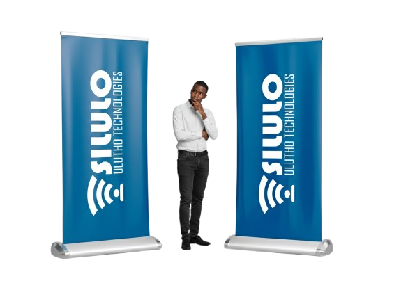 A Black Guy Standing Between Two Roll Up Banners