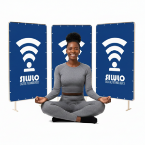 A woman sitting in front of three banners