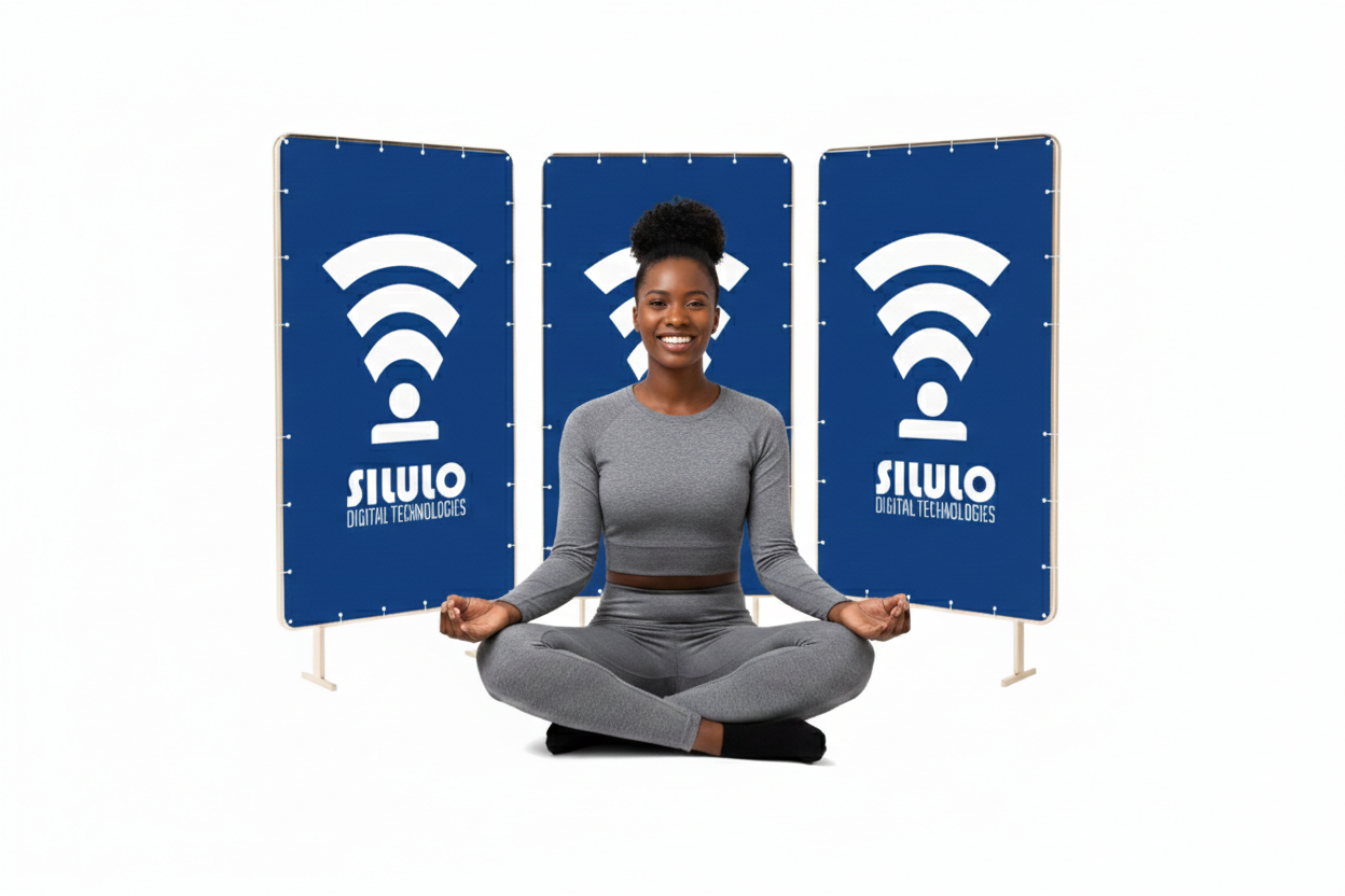 A woman sitting in front of three banners